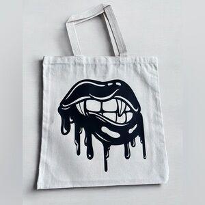 cotton tote bag with vampire kiss graphic